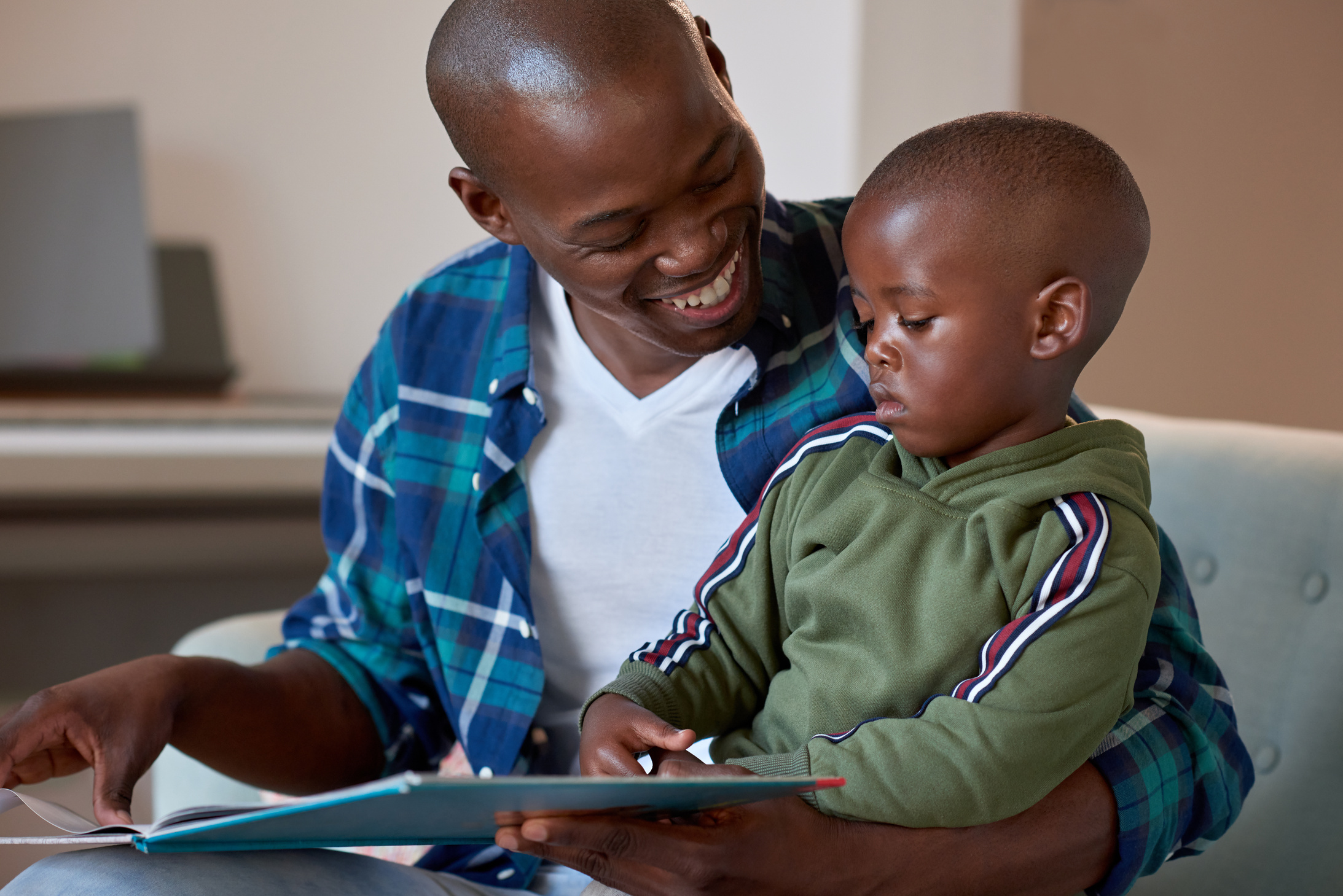 Happy father reading to child